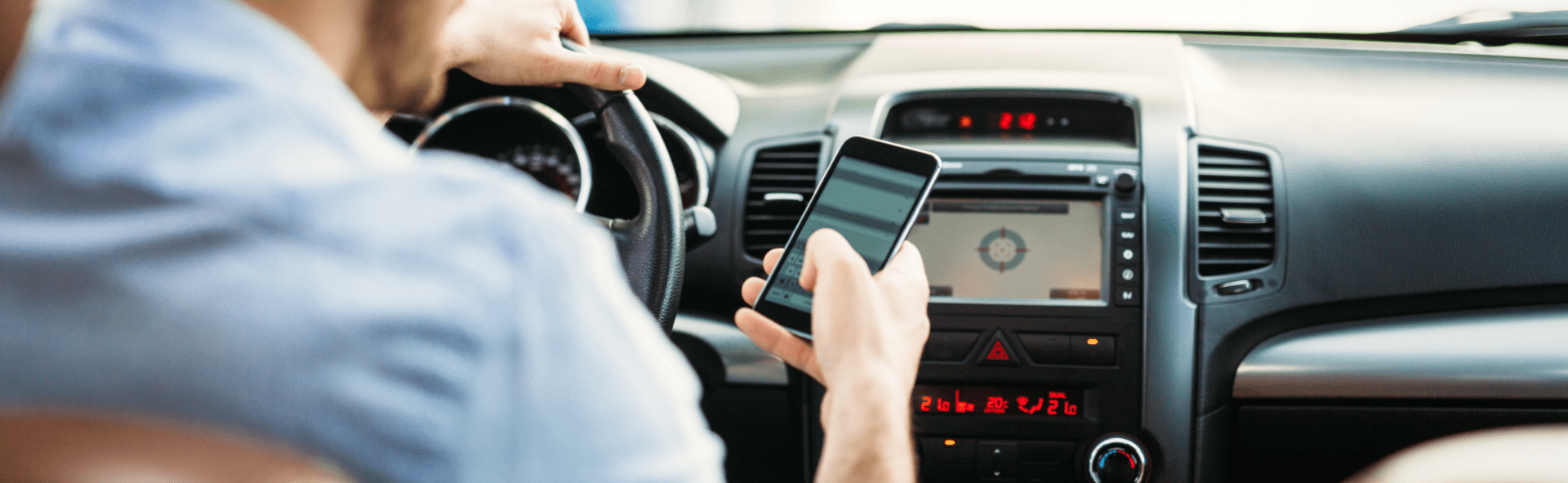 Man using phone in car